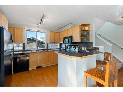 63 Tuscany Springs Rise Nw, Calgary, AB - Indoor Photo Showing Kitchen With Double Sink