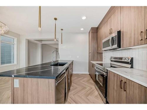 37 Shale Avenue, Cochrane, AB - Indoor Photo Showing Kitchen With Double Sink With Upgraded Kitchen