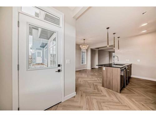 37 Shale Avenue, Cochrane, AB - Indoor Photo Showing Kitchen With Upgraded Kitchen