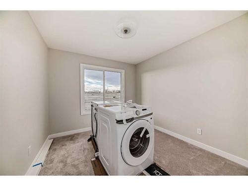 37 Shale Avenue, Cochrane, AB - Indoor Photo Showing Laundry Room