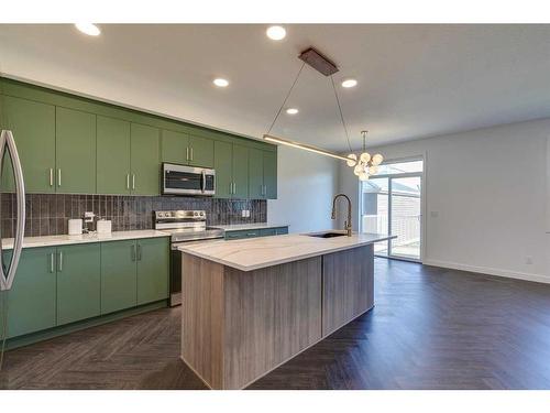 36 Clydesdale Court, Cochrane, AB - Indoor Photo Showing Kitchen With Upgraded Kitchen