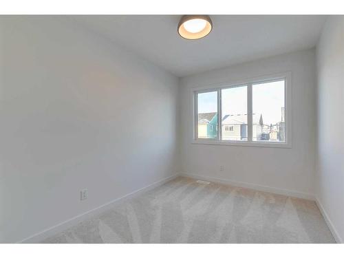 152 Cobblestone Gate, Airdrie, AB - Indoor Photo Showing Laundry Room