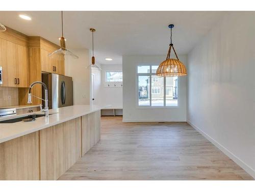 152 Cobblestone Gate, Airdrie, AB - Indoor Photo Showing Kitchen With Upgraded Kitchen