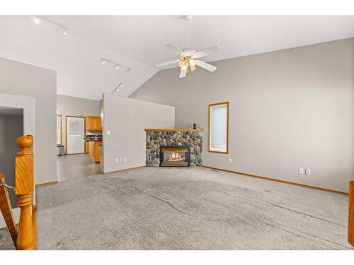 2109 22 Avenue, Didsbury, AB - Indoor With Fireplace