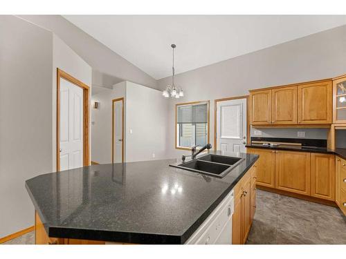 2109 22 Avenue, Didsbury, AB - Indoor Photo Showing Kitchen With Double Sink