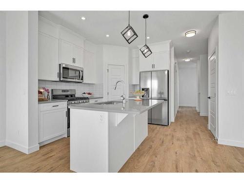 305 Ambleton Drive Nw, Calgary, AB - Indoor Photo Showing Kitchen With Stainless Steel Kitchen With Upgraded Kitchen