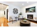 14 Copperstone Drive Se, Calgary, AB  - Indoor Photo Showing Living Room With Fireplace 