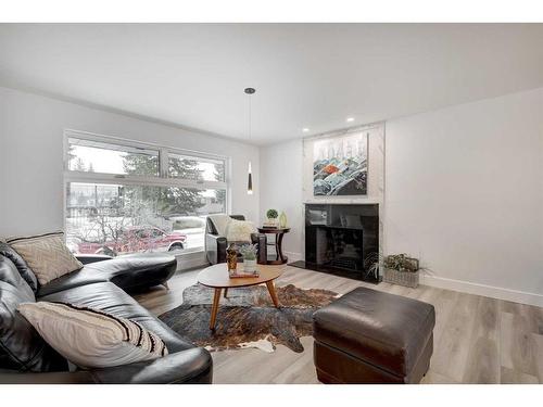 435 Queensland Road Se, Calgary, AB - Indoor Photo Showing Living Room With Fireplace