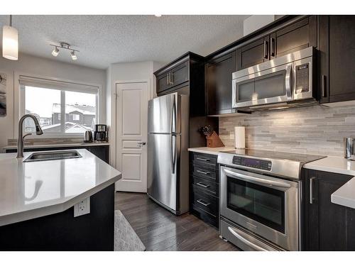 48 Auburn Meadows Boulevard Se, Calgary, AB - Indoor Photo Showing Kitchen With Stainless Steel Kitchen With Double Sink With Upgraded Kitchen