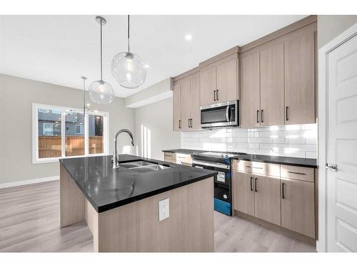 70 Sandpiper Bend, Chestermere, AB - Indoor Photo Showing Kitchen With Double Sink With Upgraded Kitchen