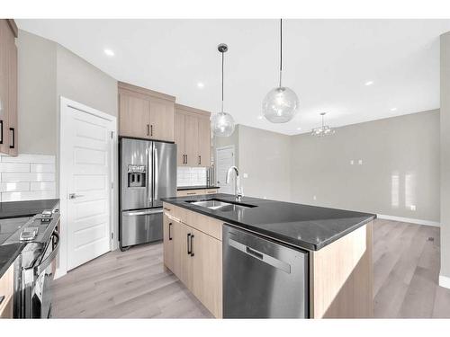 70 Sandpiper Bend, Chestermere, AB - Indoor Photo Showing Kitchen With Upgraded Kitchen