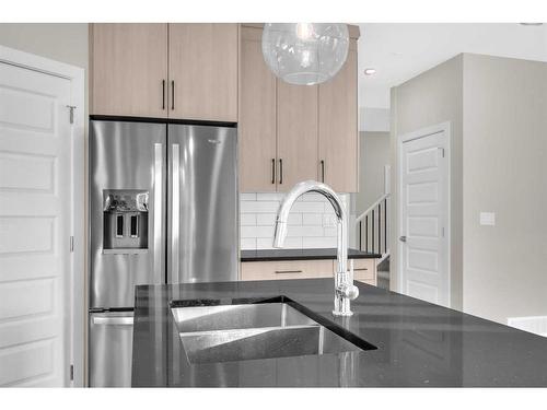 70 Sandpiper Bend, Chestermere, AB - Indoor Photo Showing Kitchen With Double Sink With Upgraded Kitchen