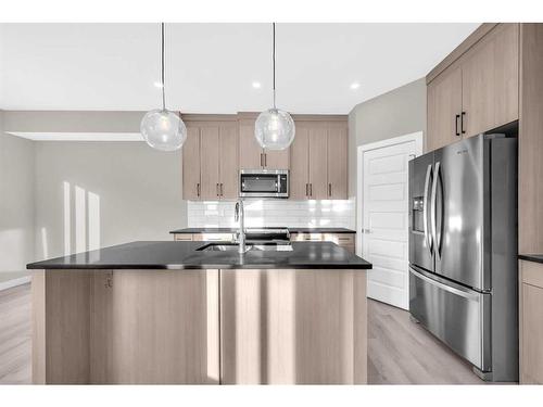 70 Sandpiper Bend, Chestermere, AB - Indoor Photo Showing Kitchen With Upgraded Kitchen