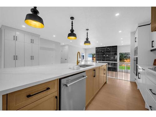 9828 19 Street Sw, Calgary, AB - Indoor Photo Showing Kitchen With Double Sink With Upgraded Kitchen