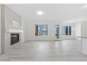 40 Carringham Gate Nw, Calgary, AB  - Indoor Photo Showing Living Room With Fireplace 