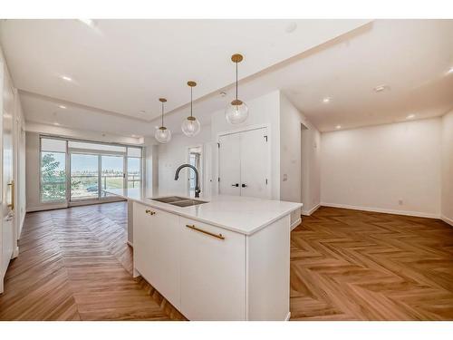 313-8445 Broadcast Avenue Sw, Calgary, AB - Indoor Photo Showing Kitchen With Double Sink With Upgraded Kitchen