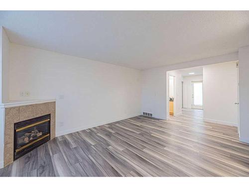 36-111 Tarawood Lane Ne, Calgary, AB - Indoor Photo Showing Living Room With Fireplace