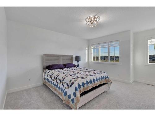 312 Heartland Way, Cochrane, AB - Indoor Photo Showing Bedroom