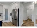 312 Heartland Way, Cochrane, AB  - Indoor Photo Showing Kitchen 