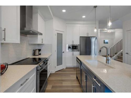 312 Heartland Way, Cochrane, AB - Indoor Photo Showing Kitchen With Upgraded Kitchen