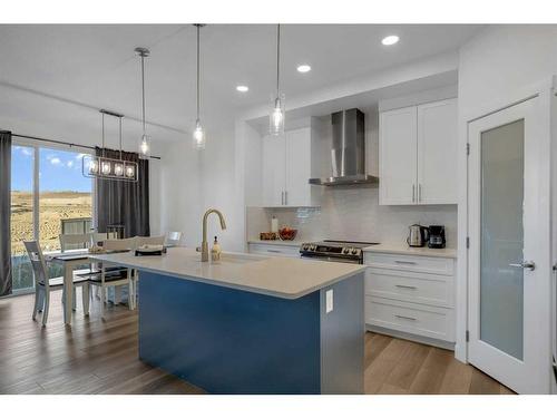 312 Heartland Way, Cochrane, AB - Indoor Photo Showing Kitchen With Upgraded Kitchen