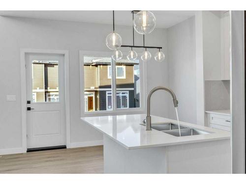 181 Waterford Way, Chestermere, AB - Indoor Photo Showing Kitchen With Double Sink