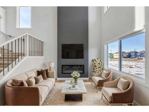 181 Waterford Way, Chestermere, AB - Indoor Photo Showing Living Room With Fireplace