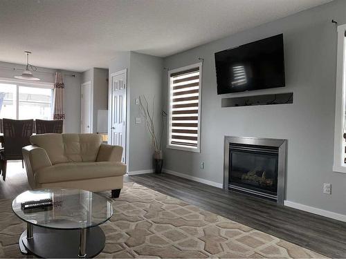 49 Royal Elm Mews Nw, Calgary, AB - Indoor Photo Showing Living Room With Fireplace