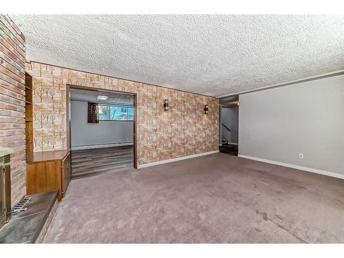 36 Anders Close, Red Deer, AB - Indoor Photo Showing Other Room With Fireplace