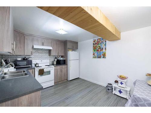 1323 Marlyn Way Ne, Calgary, AB - Indoor Photo Showing Kitchen With Double Sink