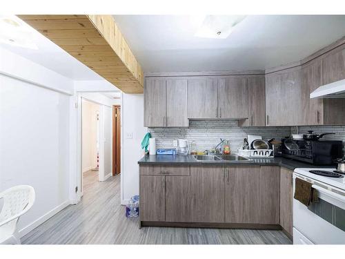 1323 Marlyn Way Ne, Calgary, AB - Indoor Photo Showing Kitchen With Double Sink