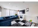 1323 Marlyn Way Ne, Calgary, AB  - Indoor Photo Showing Living Room With Fireplace 