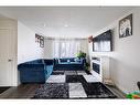 1323 Marlyn Way Ne, Calgary, AB  - Indoor Photo Showing Living Room 