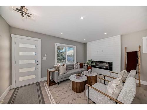 519 6 Street Ne, Calgary, AB - Indoor Photo Showing Living Room With Fireplace