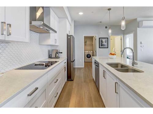 2109-42 Cranbrook Gardens Se, Calgary, AB - Indoor Photo Showing Kitchen With Double Sink With Upgraded Kitchen