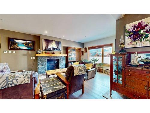 206-707 Spring Creek Drive Se, Canmore, AB - Indoor With Fireplace