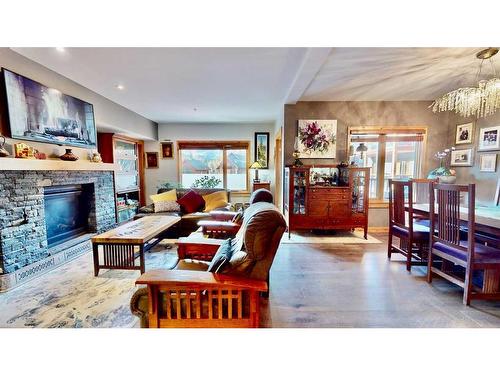 206-707 Spring Creek Drive Se, Canmore, AB - Indoor With Fireplace