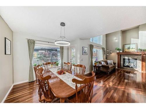 39 Wentworth Close Sw, Calgary, AB - Indoor Photo Showing Dining Room With Fireplace