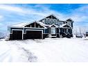 49 303 Avenue West, Rural Foothills County, AB  - Outdoor With Facade 