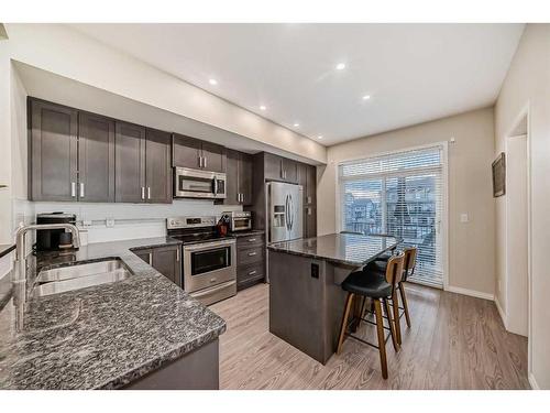 503-1086 Williamstown Boulevard Nw, Airdrie, AB - Indoor Photo Showing Kitchen With Stainless Steel Kitchen With Double Sink