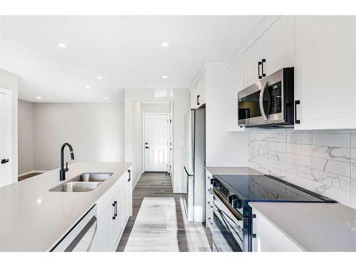 1362 148 Avenue Nw, Calgary, AB - Indoor Photo Showing Kitchen With Stainless Steel Kitchen With Double Sink With Upgraded Kitchen