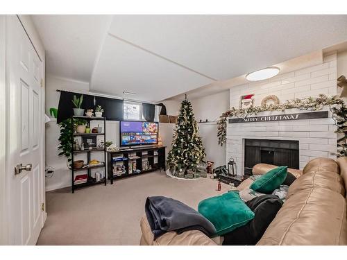 24 Erin Meadow Way Se, Calgary, AB - Indoor With Fireplace