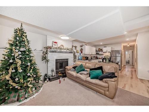 24 Erin Meadow Way Se, Calgary, AB - Indoor Photo Showing Living Room With Fireplace