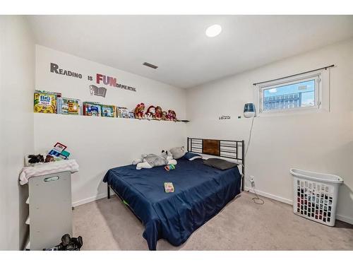 24 Erin Meadow Way Se, Calgary, AB - Indoor Photo Showing Bedroom