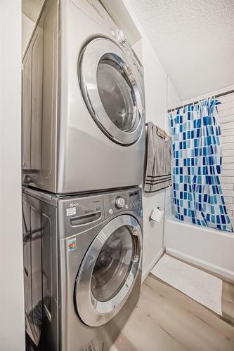 24 Erin Meadow Way Se, Calgary, AB - Indoor Photo Showing Laundry Room