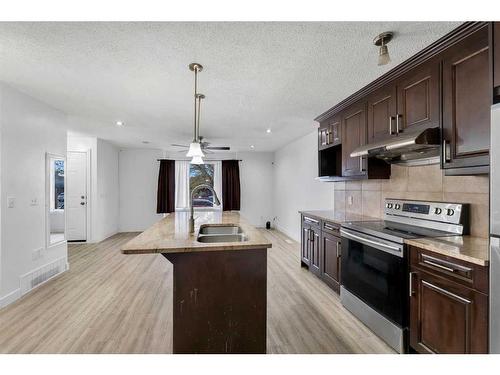 136 Whitefield Drive Ne, Calgary, AB - Indoor Photo Showing Kitchen With Double Sink