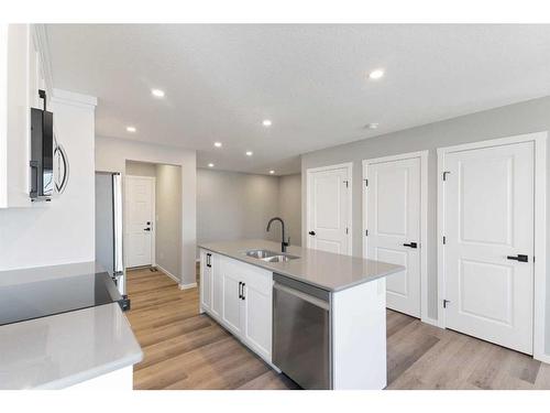 257 Yorkville Boulevard Sw, Calgary, AB - Indoor Photo Showing Kitchen With Double Sink