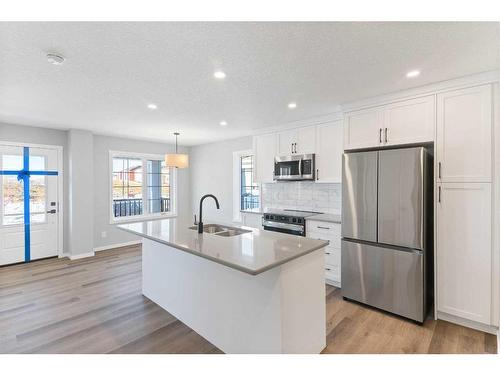 257 Yorkville Boulevard Sw, Calgary, AB - Indoor Photo Showing Kitchen With Stainless Steel Kitchen With Double Sink With Upgraded Kitchen