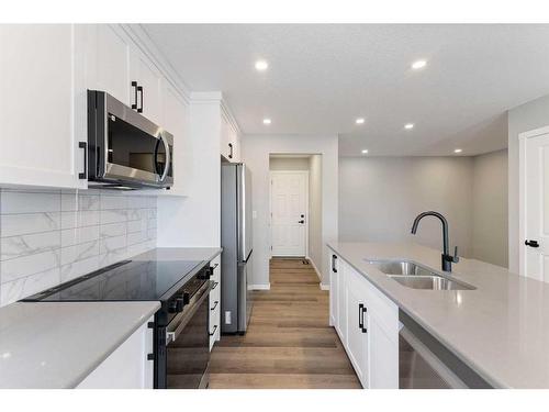 257 Yorkville Boulevard Sw, Calgary, AB - Indoor Photo Showing Kitchen With Stainless Steel Kitchen With Double Sink With Upgraded Kitchen