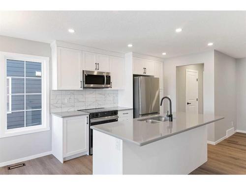 257 Yorkville Boulevard Sw, Calgary, AB - Indoor Photo Showing Kitchen With Stainless Steel Kitchen With Double Sink With Upgraded Kitchen